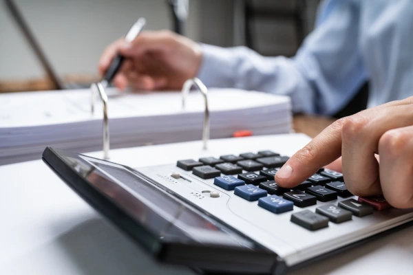hand working with a calculator