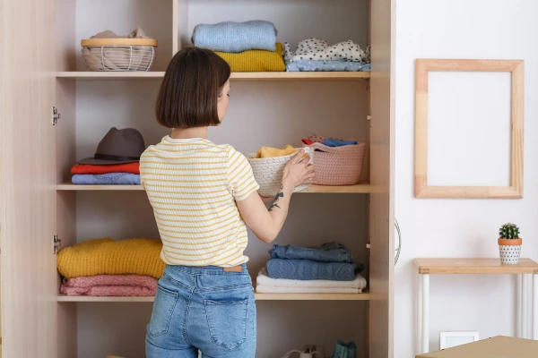 a wardrobe manager organizing a closet